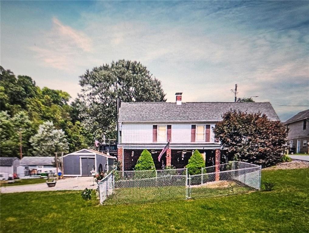front view of a house with a yard