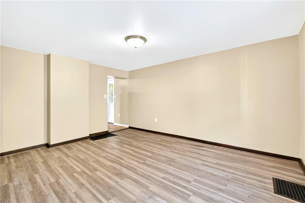 6 Browntown Road Avella, PA 15312 - Photo 14 of 49 a view of an empty room with wooden floor and a window