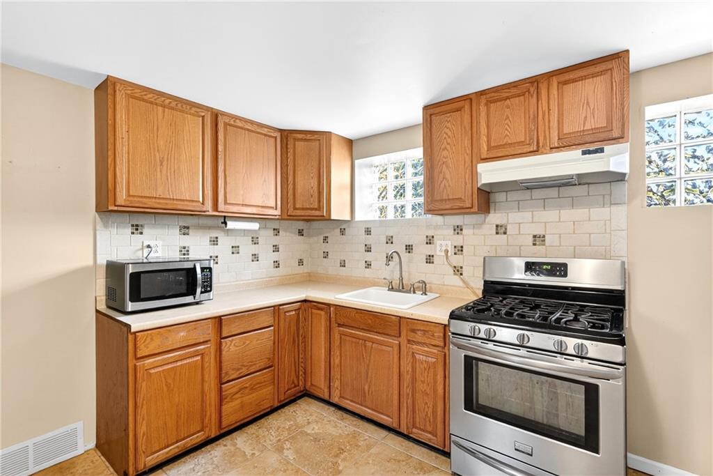 6 Browntown Road Avella, PA 15312 - Photo 4 of 49 a kitchen with cabinets appliances and a window