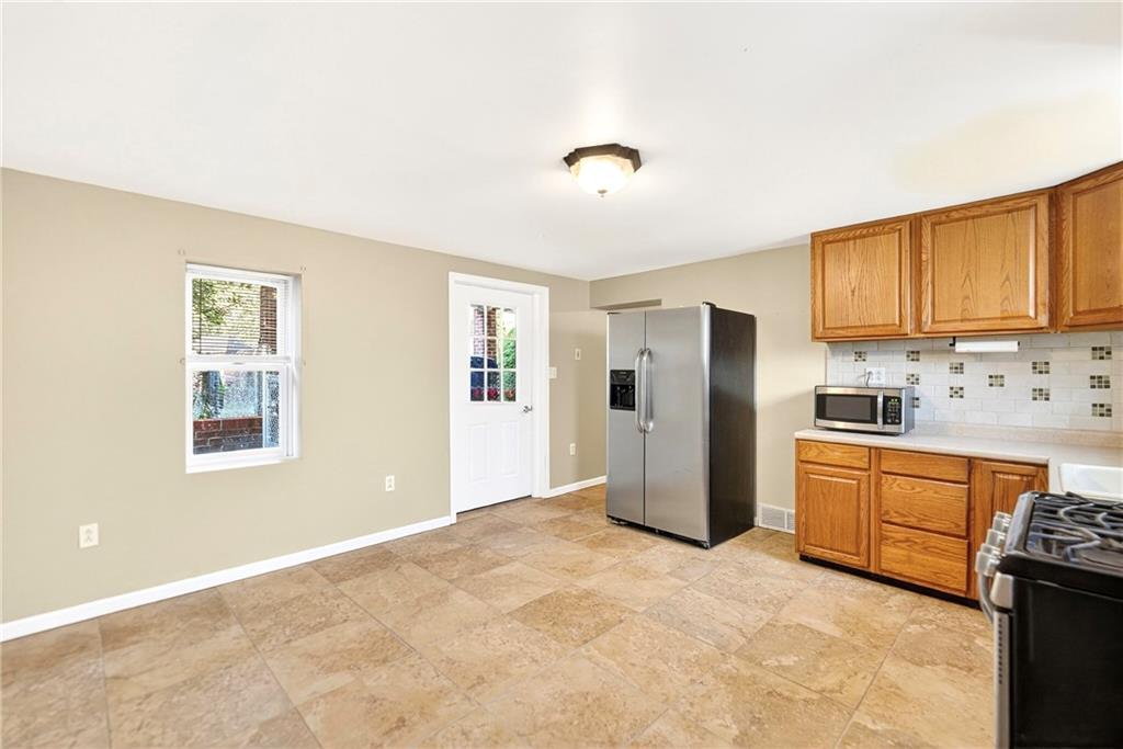 6 Browntown Road Avella, PA 15312 - Photo 5 of 49 a kitchen with stainless steel appliances granite countertop a refrigerator sink and stove