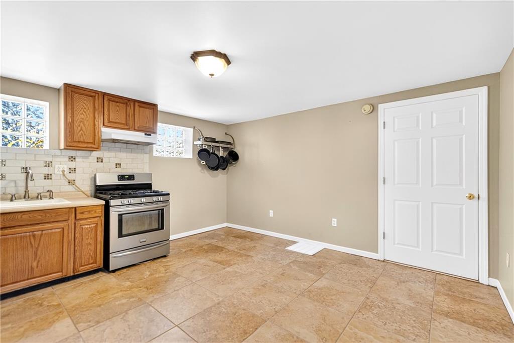 6 Browntown Road Avella, PA 15312 - Photo 8 of 49 a kitchen with a stove top oven sink and cabinets