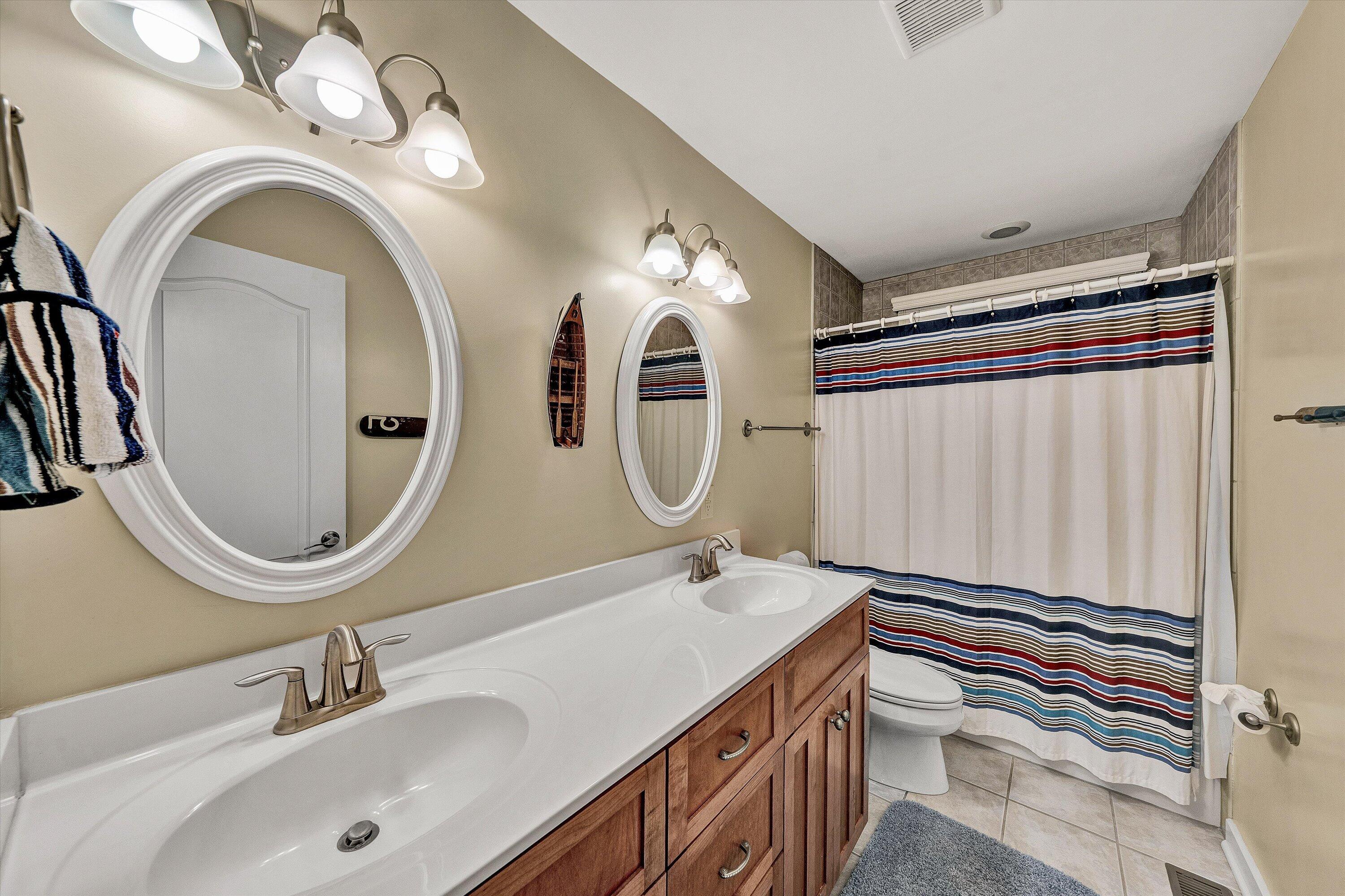 207 Winding Way Union Hall, VA 24176 - Photo 40 of 60 a en suite bathroom with a granite countertop sink and a mirror