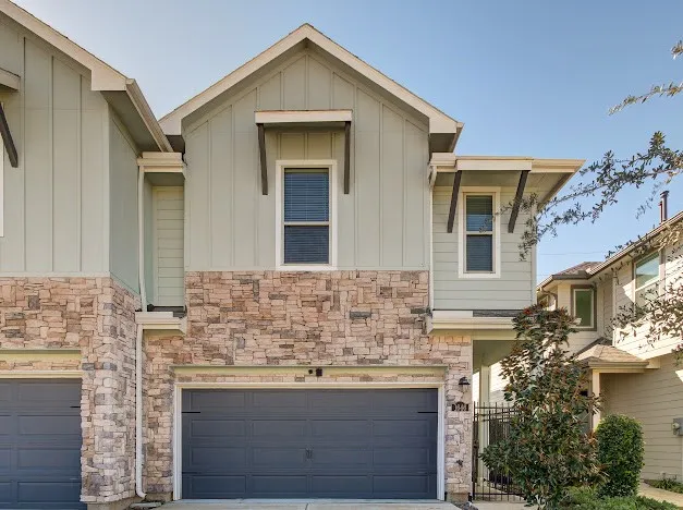 a kitchen with stainless steel appliances granite countertop a refrigerator sink stove and microwave