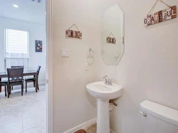 a bathroom with a sink toilet
