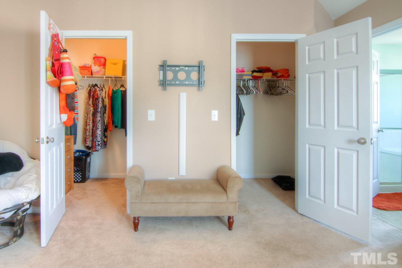 115 Darley Dale Loop Apex, NC 27502 - Photo 13 of 25 a living room with furniture and a refrigerator