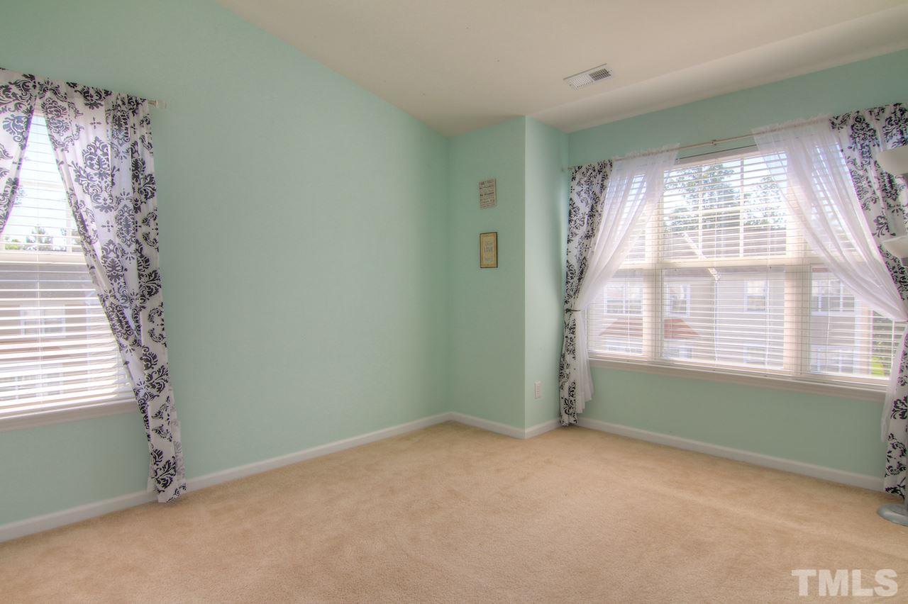 115 Darley Dale Loop Apex, NC 27502 - Photo 14 of 25 a view of an empty room with a window