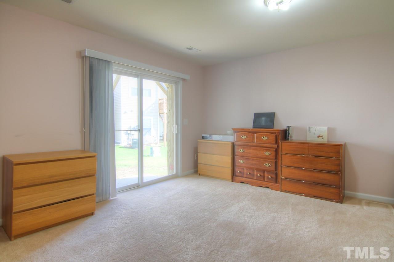 115 Darley Dale Loop Apex, NC 27502 - Photo 20 of 25 a livingroom with furniture and a window