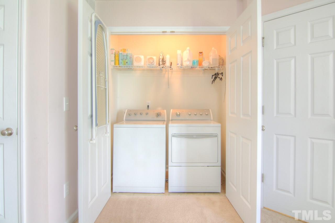 115 Darley Dale Loop Apex, NC 27502 - Photo 23 of 25 a bathroom with a sink