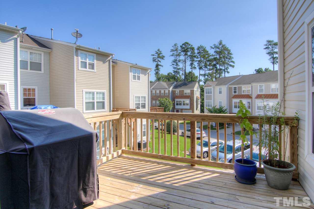 115 Darley Dale Loop Apex, NC 27502 - Photo 24 of 25 a view of a house with a deck and a patio