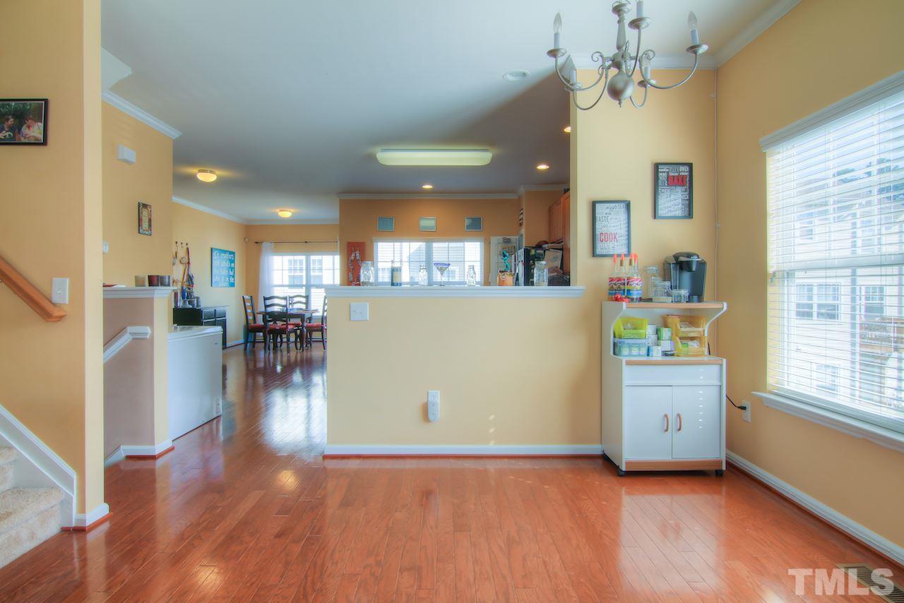 115 Darley Dale Loop Apex, NC 27502 - Photo 4 of 25 a view of a kitchen and dining room