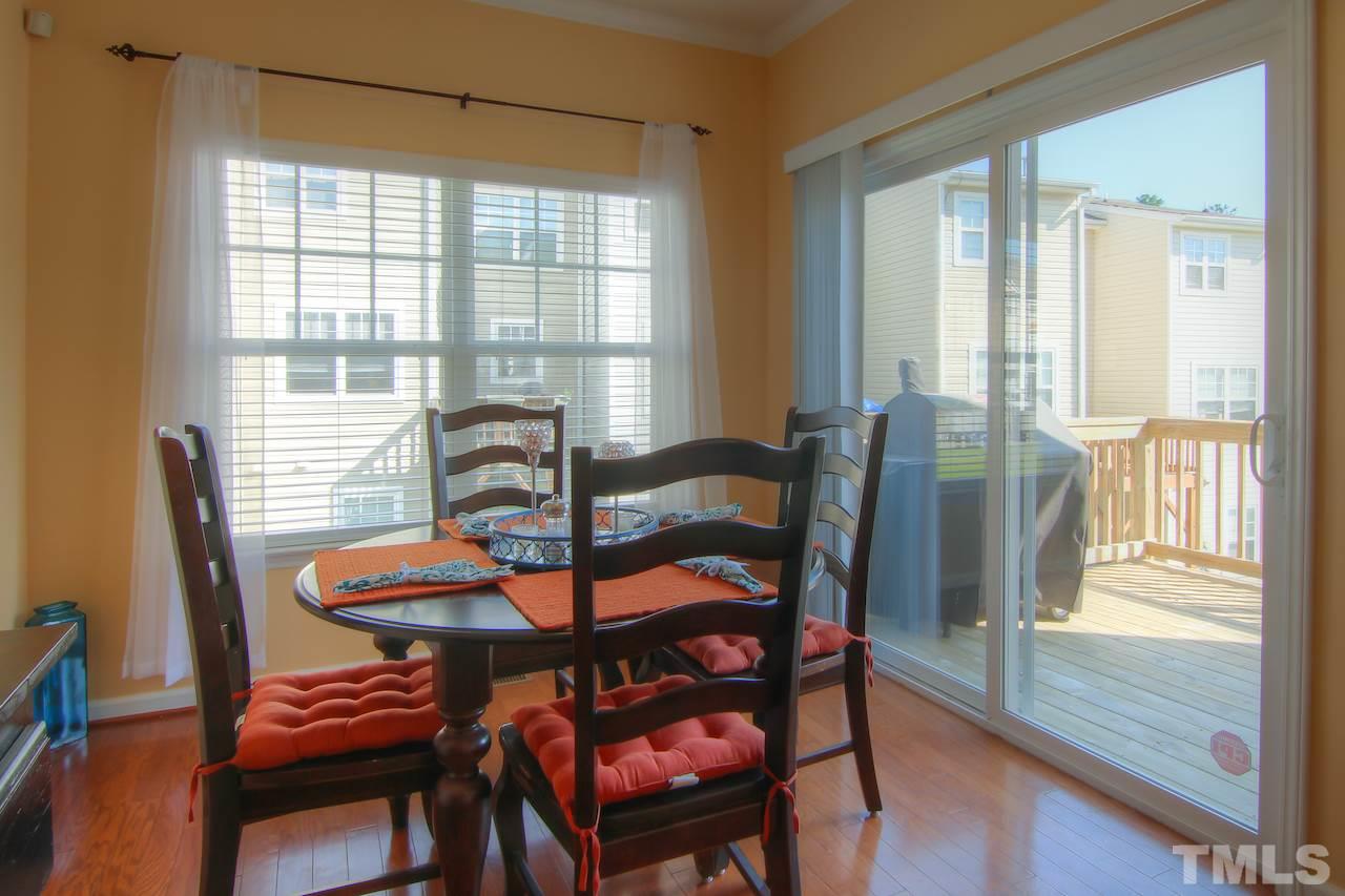 115 Darley Dale Loop Apex, NC 27502 - Photo 9 of 25 a dining room with furniture window and wooden floor