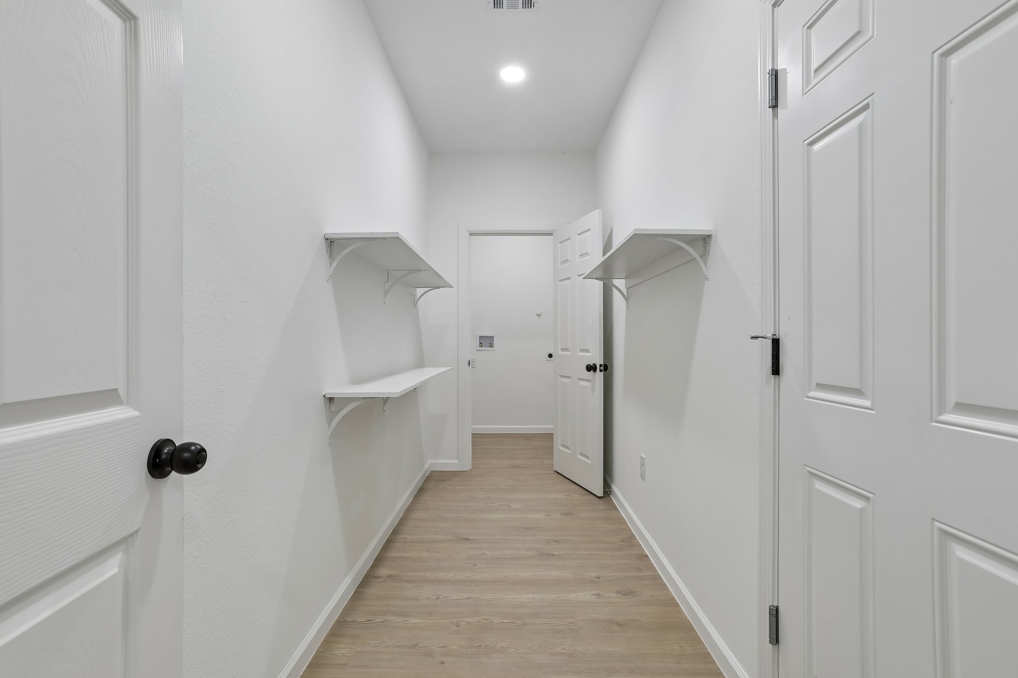 210 Flint Ridge Street Bastrop, TX 78602 - Photo 14 of 40 a view of a hallway with white walls