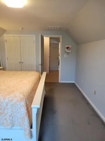 a bedroom with a bed and closet