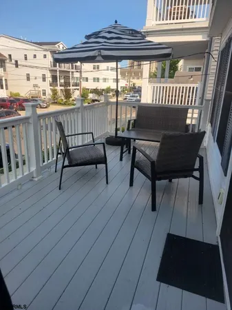 a view of a balcony with furniture