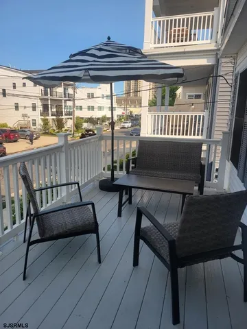 a view of a porch with furniture and a window