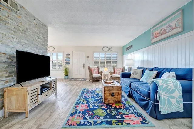 a living room with furniture and a window