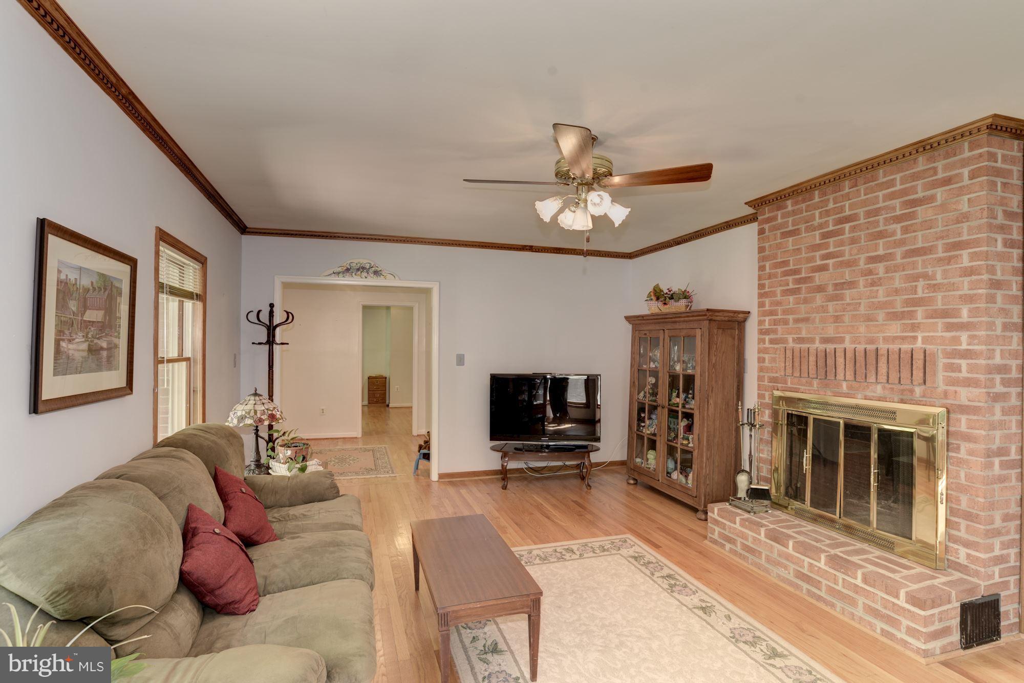 7100 Stone Road Manassas, VA 20111 - Photo 13 of 29 Living room showing wood burning fireplace