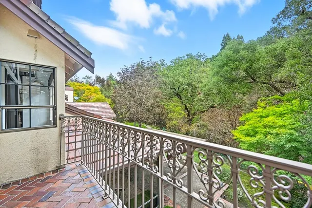 a view of a patio with table and chairs