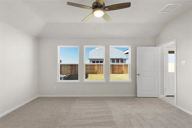 an aerial view of a house with outdoor space