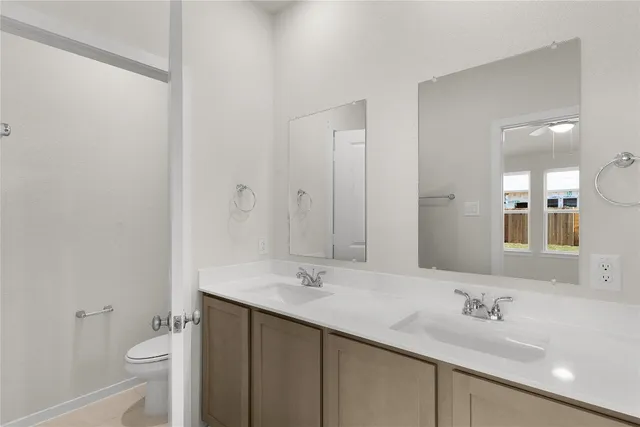 a view of a swimming pool with a patio and a garden