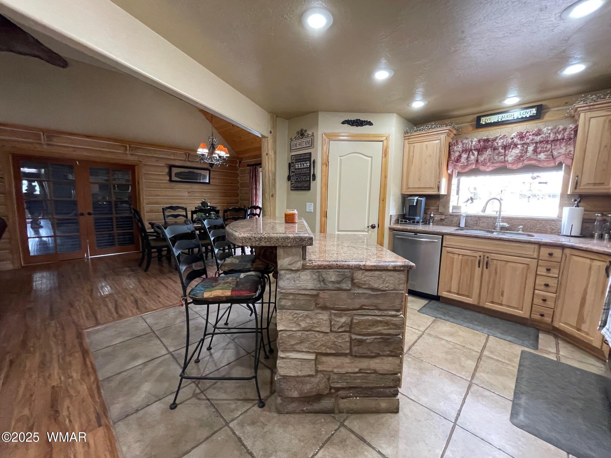 183 North Becker Lake Road Springerville, AZ 85938 - Photo 17 of 41 a kitchen with kitchen island granite countertop a sink and counter space