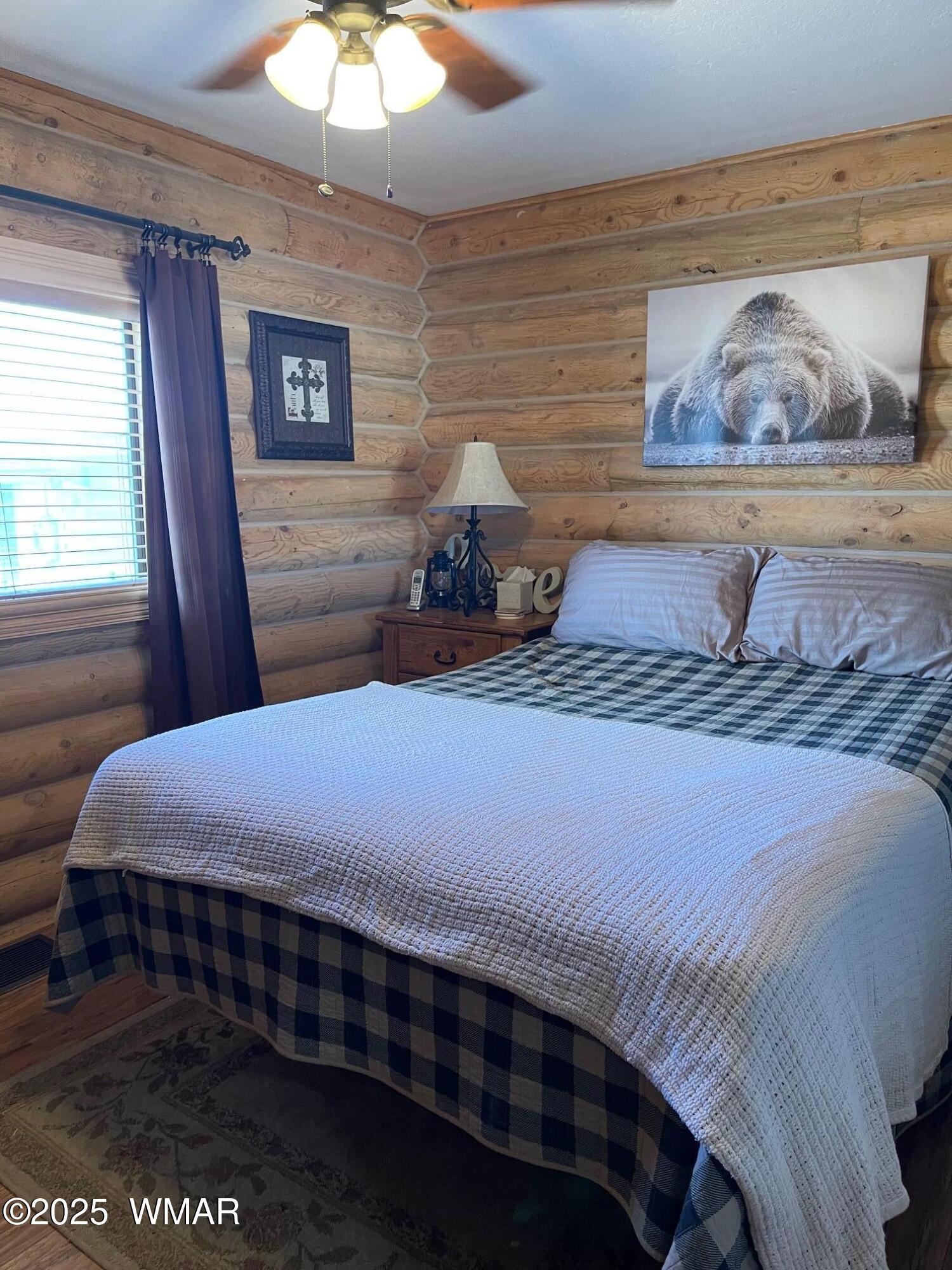 183 North Becker Lake Road Springerville, AZ 85938 - Photo 20 of 41 a bedroom with a bed and a painting on the wall
