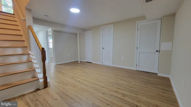 a view of entryway with wooden floor