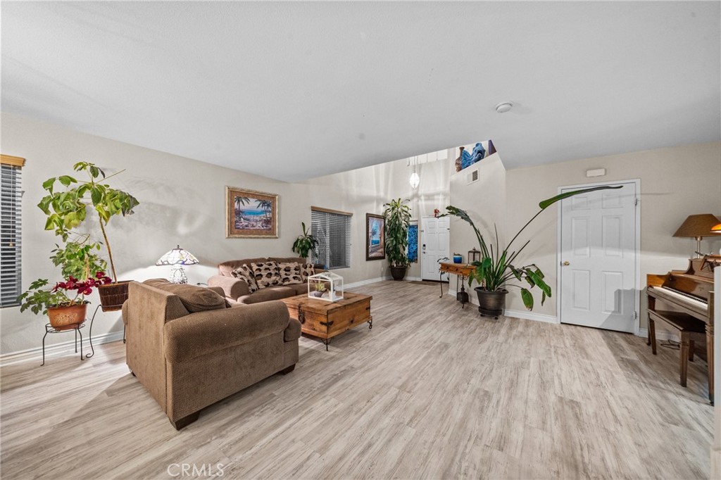 809 Classic Avenue Beaumont, CA 92223 - Photo 11 of 41 a living room with furniture and wooden floor