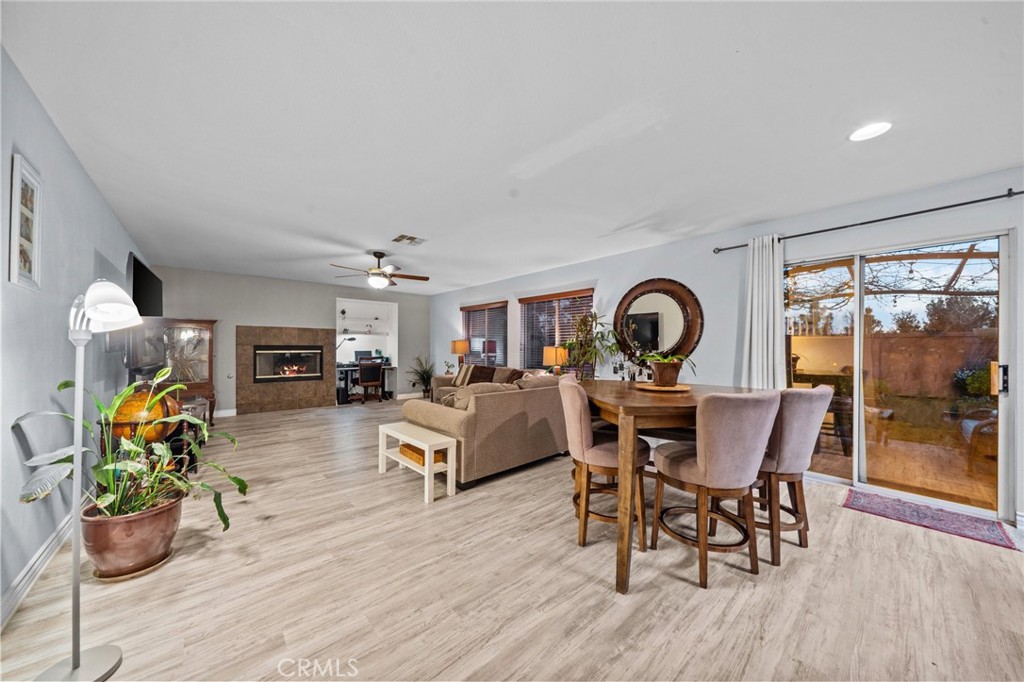 809 Classic Avenue Beaumont, CA 92223 - Photo 12 of 41 a view of a dining room with furniture window and wooden floor