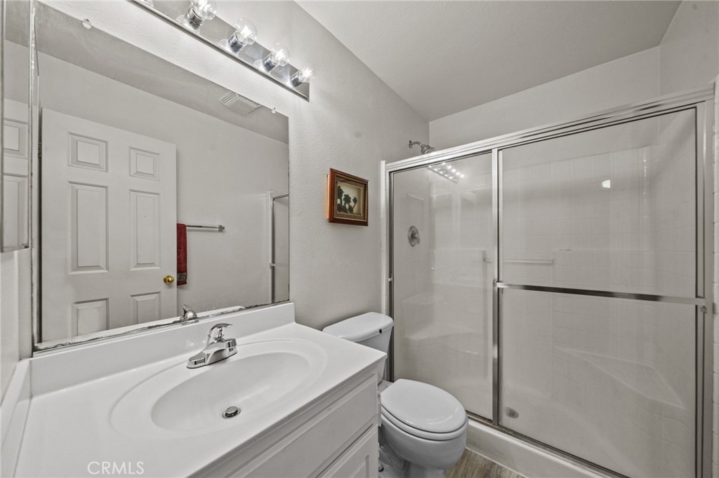 809 Classic Avenue Beaumont, CA 92223 - Photo 16 of 41 a bathroom with a sink toilet and shower