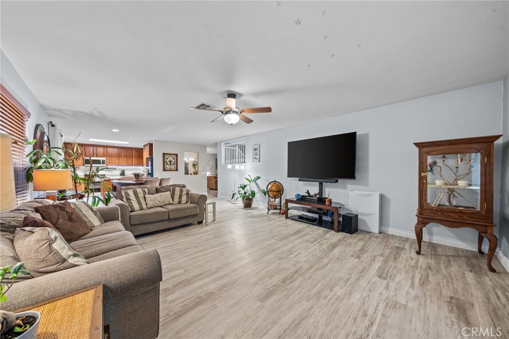 809 Classic Avenue Beaumont, CA 92223 - Photo 17 of 41 a living room with furniture and a flat screen tv