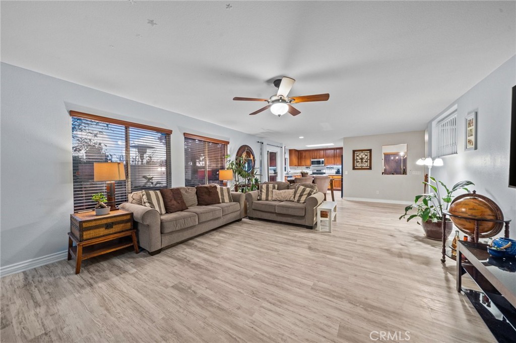 809 Classic Avenue Beaumont, CA 92223 - Photo 18 of 41 a living room with furniture and a wooden floor