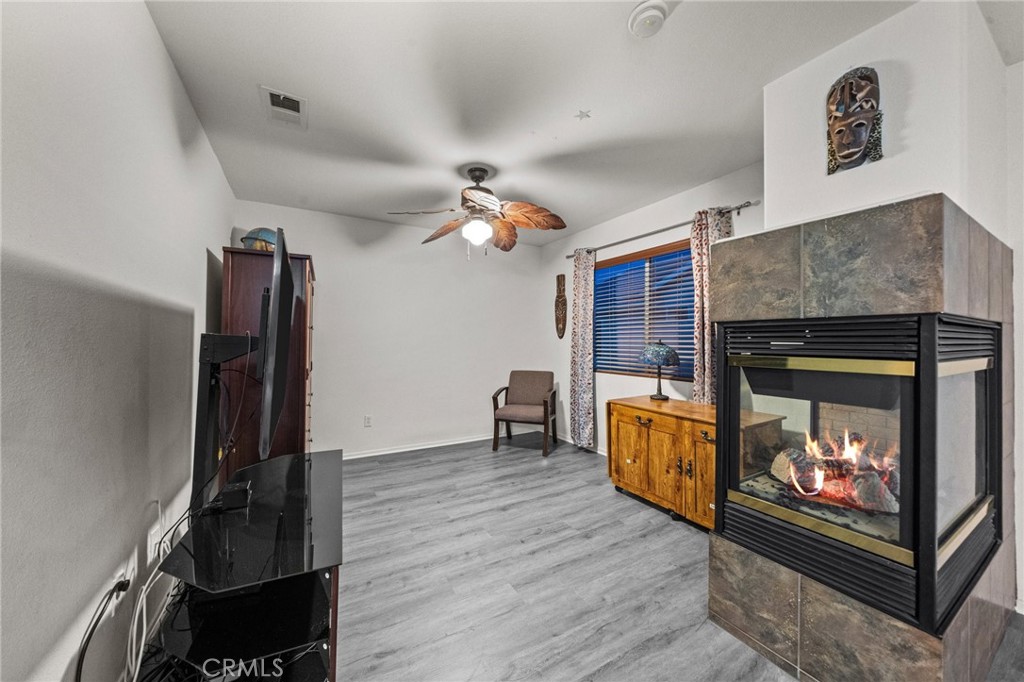 809 Classic Avenue Beaumont, CA 92223 - Photo 30 of 41 a living room with furniture and a fireplace