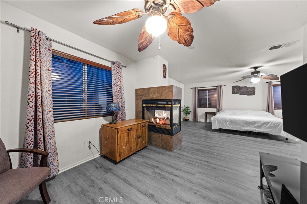 809 Classic Avenue Beaumont, CA 92223 - Photo 31 of 41 a living room with furniture and a fireplace