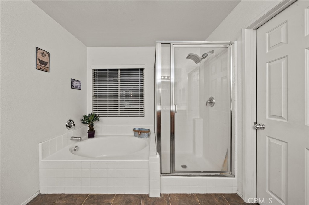 809 Classic Avenue Beaumont, CA 92223 - Photo 34 of 41 a white bath tub sitting next to a shower