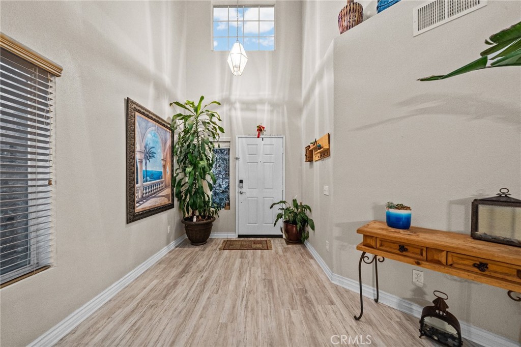 809 Classic Avenue Beaumont, CA 92223 - Photo 7 of 41 a view of livingroom with furniture and wooden floor