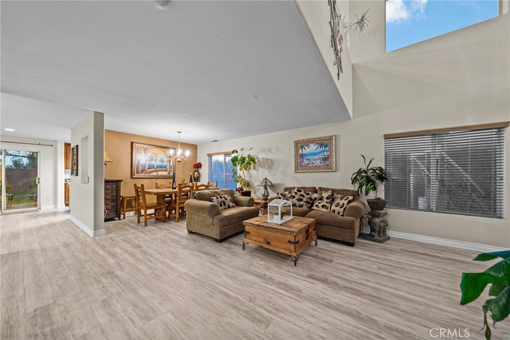 809 Classic Avenue Beaumont, CA 92223 - Photo 8 of 41 a living room with furniture and a wooden floor