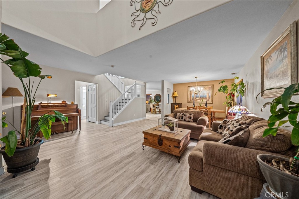809 Classic Avenue Beaumont, CA 92223 - Photo 9 of 41 a living room with furniture and a wooden floor