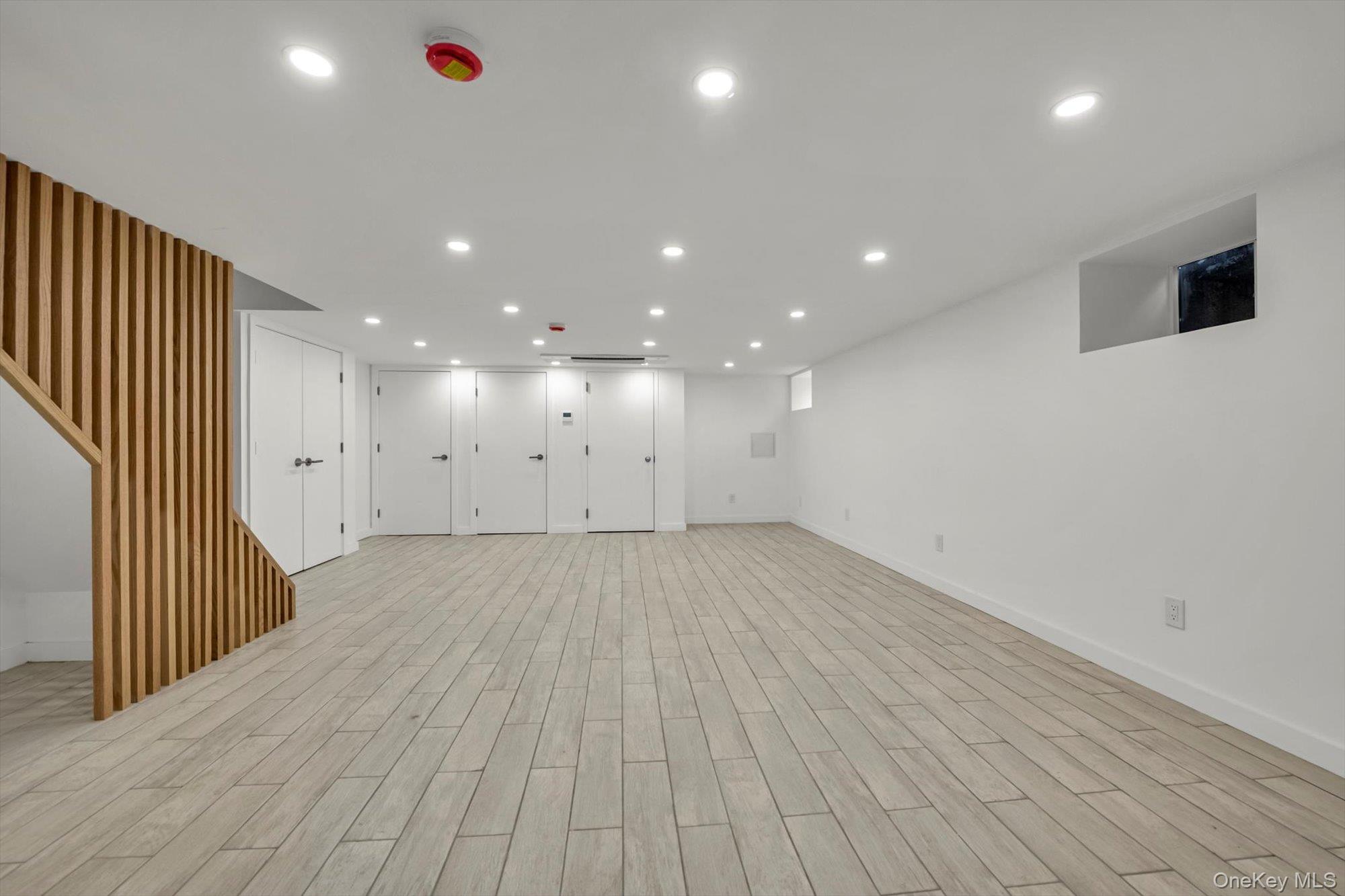 85-45 67th Road Queens, NY 11374 - Photo 11 of 28 an empty room with wooden floor