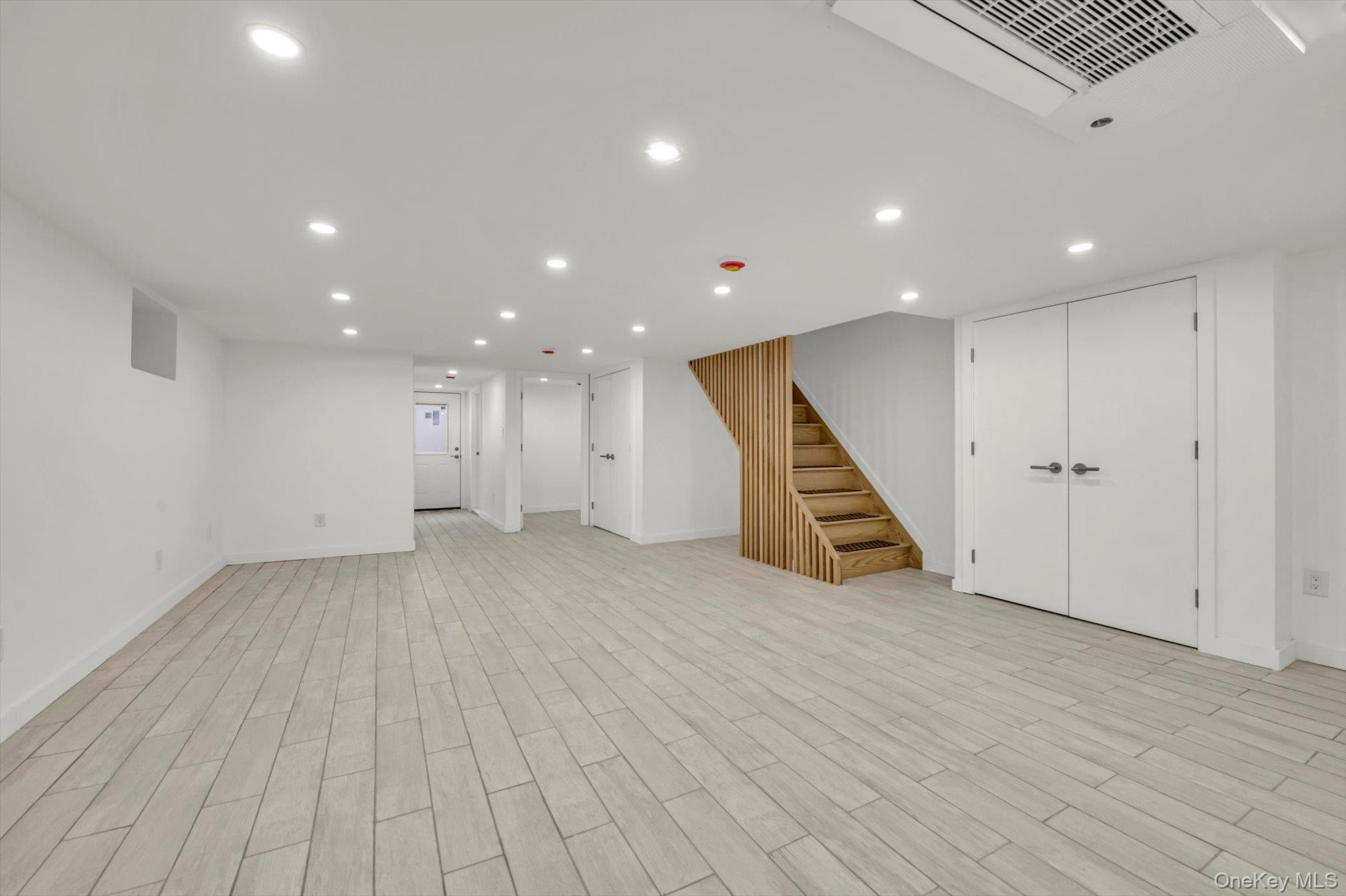 85-45 67th Road Queens, NY 11374 - Photo 12 of 28 a view of an empty room with wooden floor