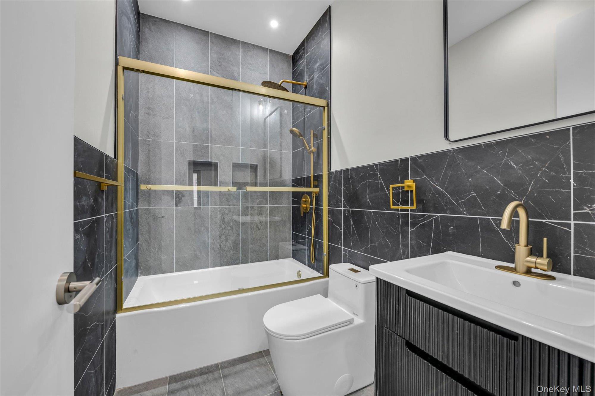 85-45 67th Road Queens, NY 11374 - Photo 21 of 28 a bathroom with a sink a toilet and shower