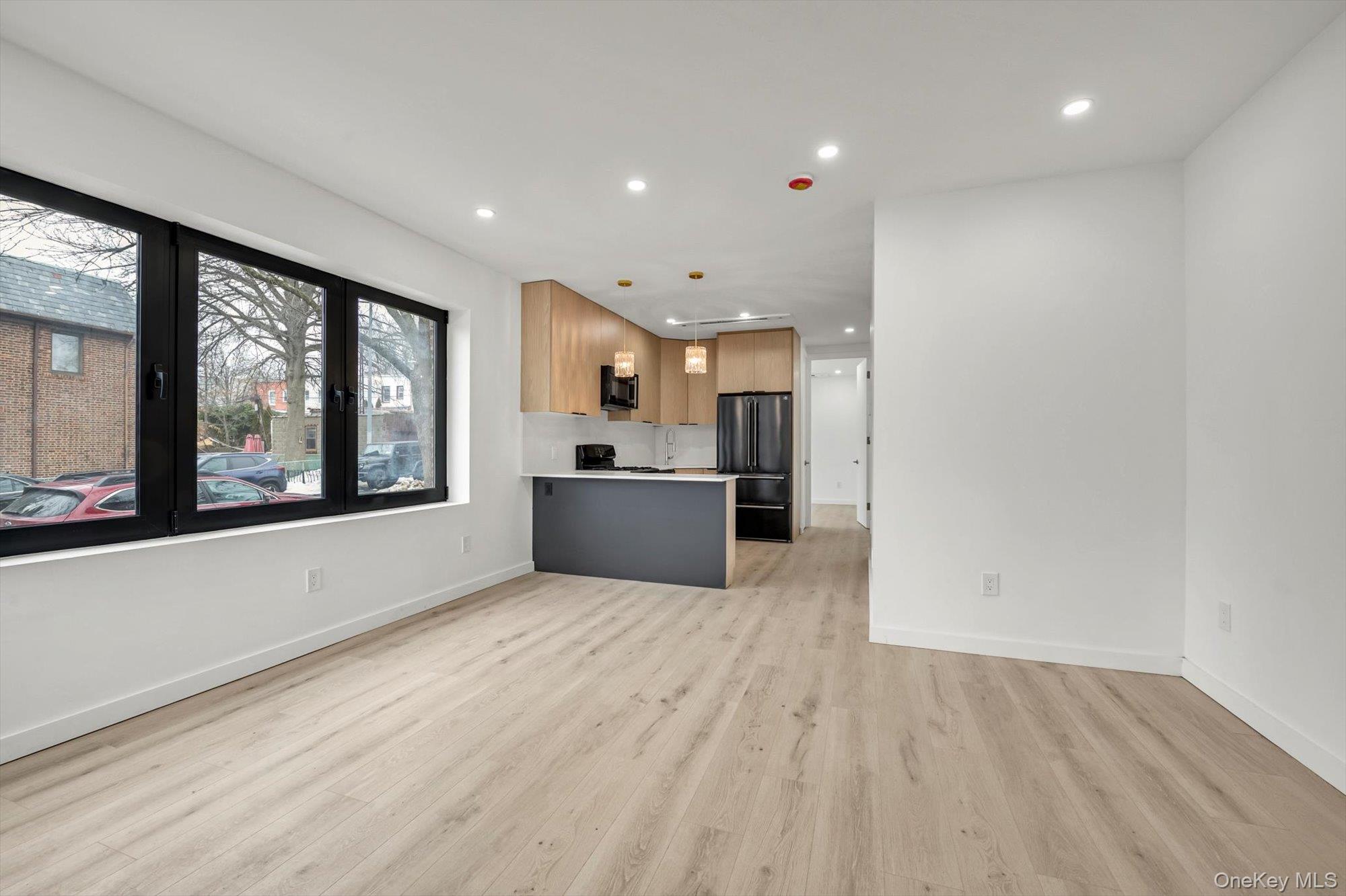 85-45 67th Road Queens, NY 11374 - Photo 4 of 28 a view of a kitchen with a sink and a large window