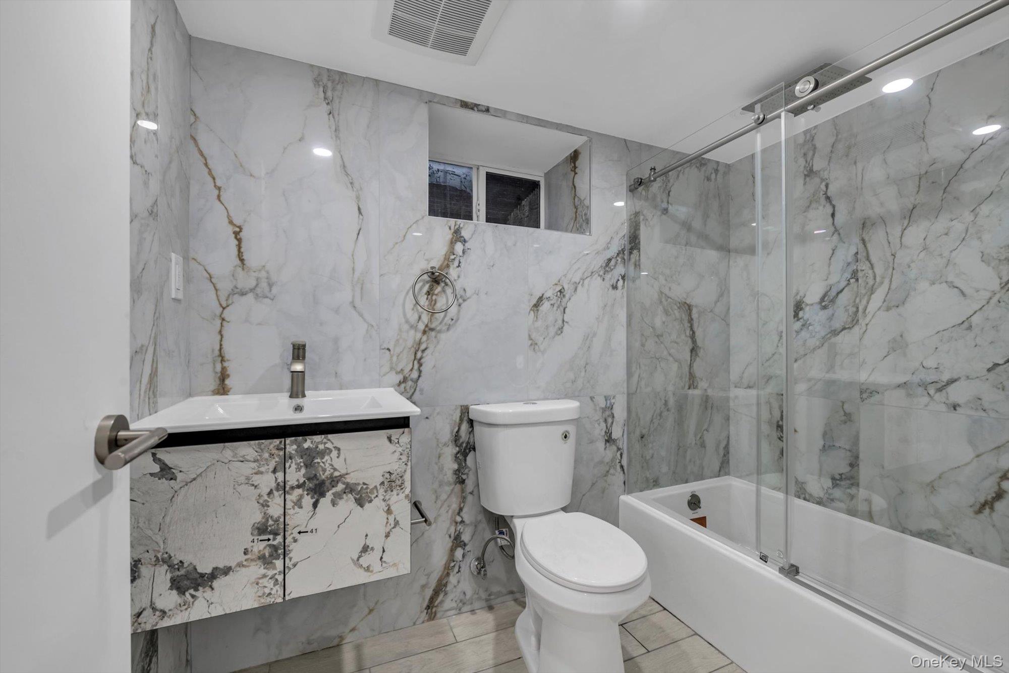 85-45 67th Road Queens, NY 11374 - Photo 10 of 28 a bathroom with a sink toilet and shower