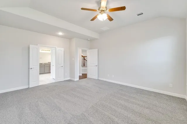 a bathroom with a granite countertop sink mirror and shower