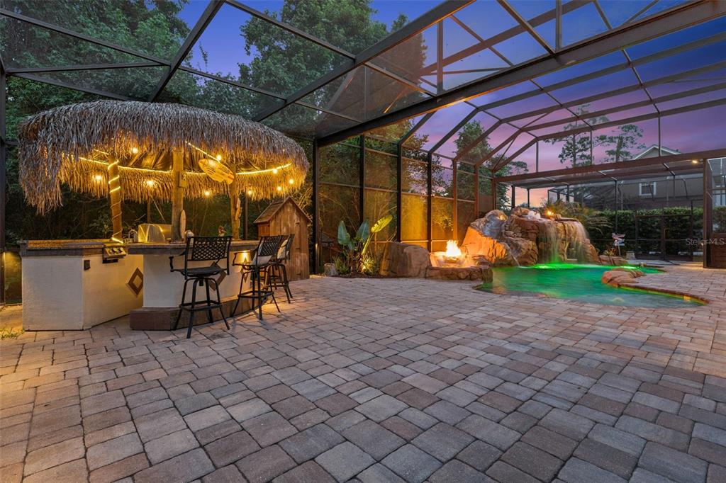 908 Croton Road Celebration, FL 34747 - Photo 7 of 86 a view of a chairs and table in a patio