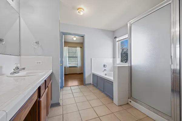 a kitchen with a sink a stove and cabinets