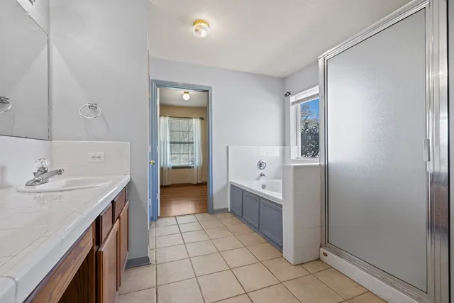a kitchen with a sink a stove and cabinets