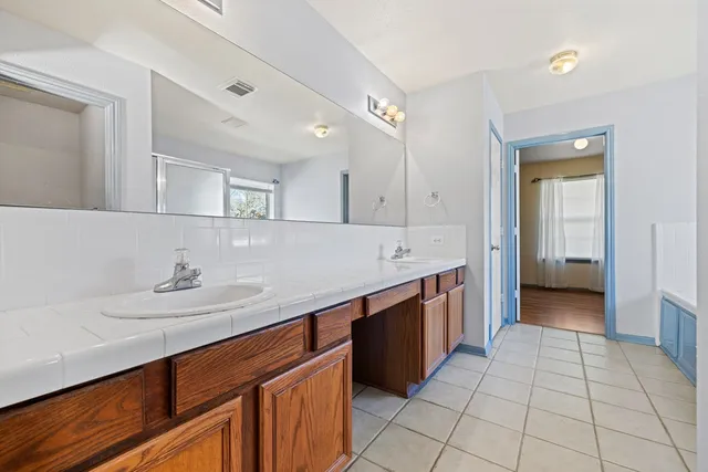 a kitchen with stainless steel appliances a sink stove and cabinets