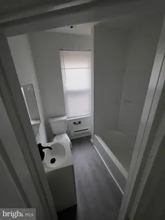 a bathroom with a sink and a shower
