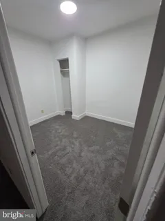 a white toilet sitting next to a white sink